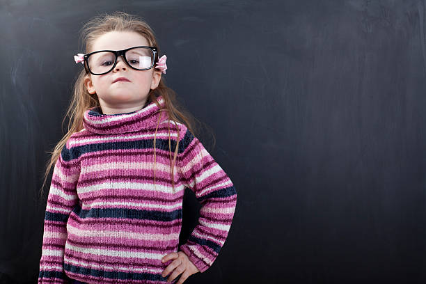 istock Cute girl in front of a chalkboard 174818260