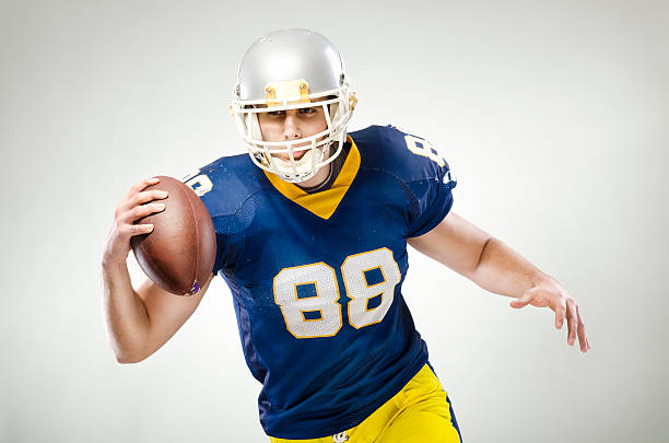Picture of a young American football player posing stock photo
