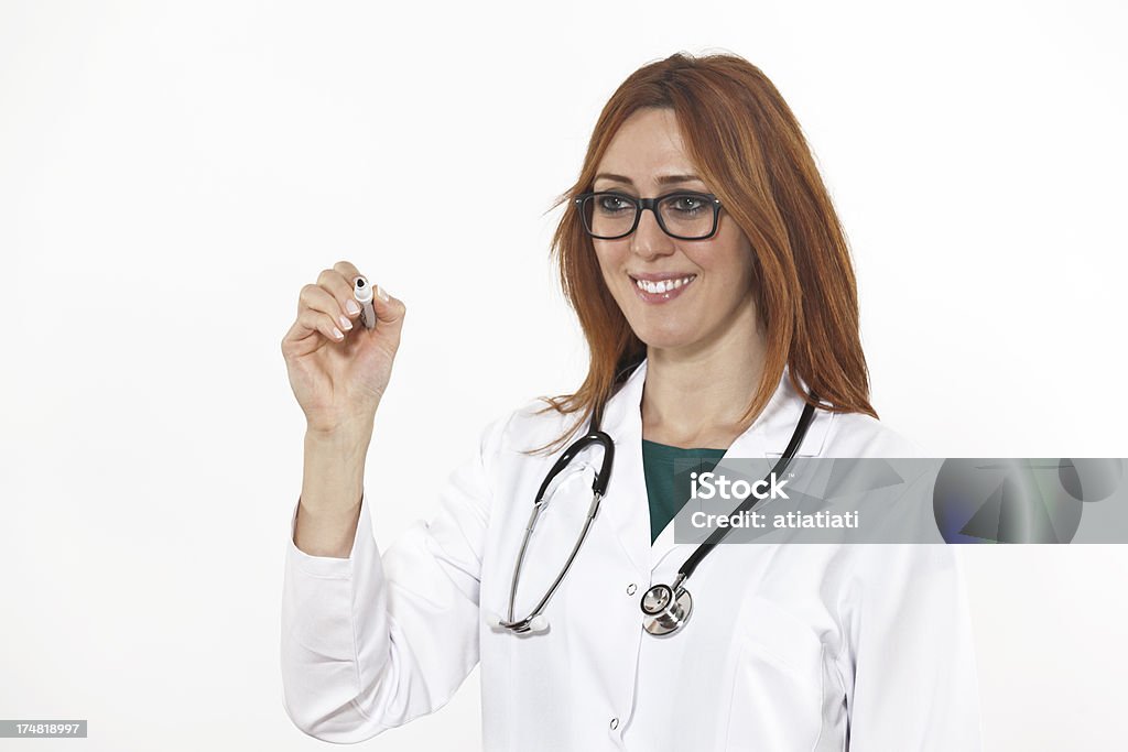Femmina medico scrivendo su aria - Foto stock royalty-free di Adulto