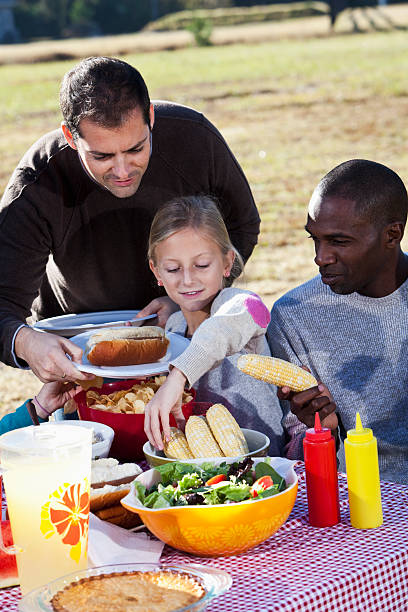 istock People at barbecue getting food 174819019
