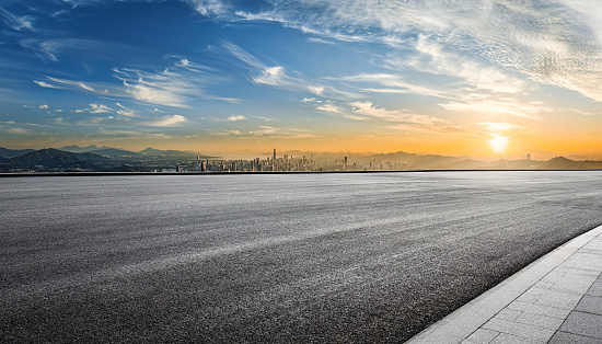 Road and skyline background at sunset in Shenzhen