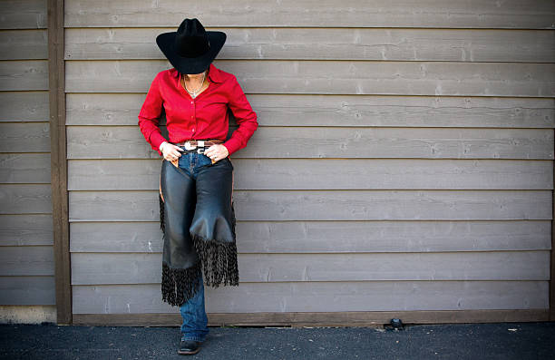 ковбой-девушка - cowboy hat real people red gray стоковые фото и изображения