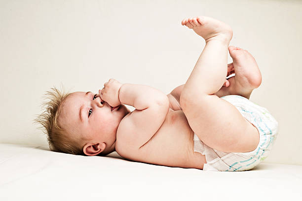 istock Baby playing with his feet 174819282