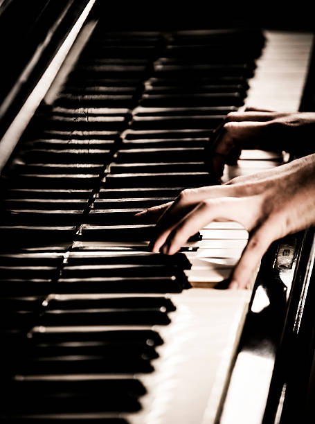 istock Woman Playing Piano 174819418