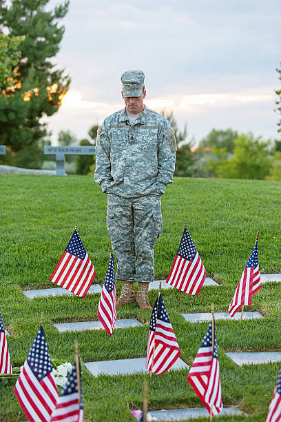 istock Soldier standing in a cemetary 174819494