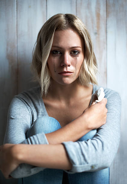 Looking for a little help Portrait of a pretty young blonde woman with mascara running down her face after crying woman mascara smudged stock pictures, royalty-free photos & images
