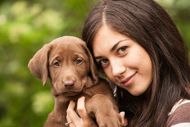 istock Young woman and her puppy 174819606
