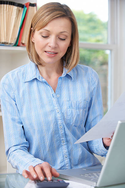 istock Woman Working On Domestic Finances In Home Office 174819730