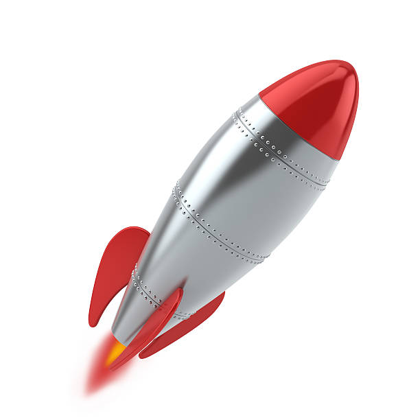 Silver and red rocket launching against white background stock photo