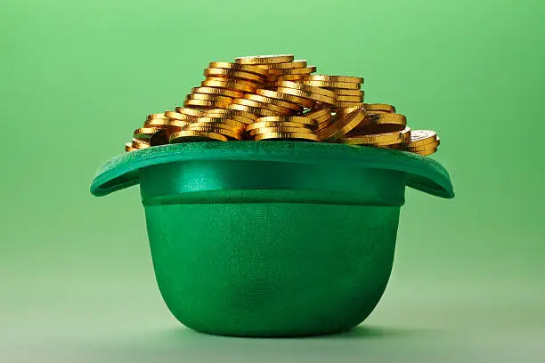 A green Leprechaun hat and gold coins.