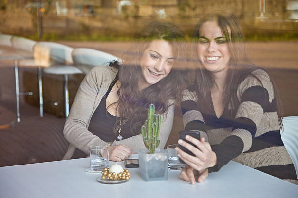 istock Friends Taking Pics With Mobile Phone 174819798