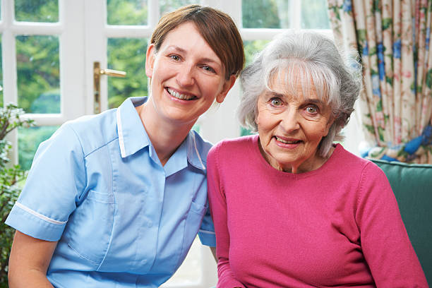 istock Senior Woman At Home With Carer 174820218