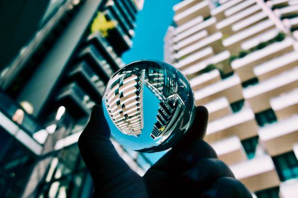 istock Crystal ball against city skyscrapers 1748203301