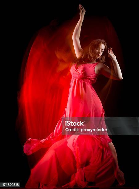 Female Dancer In Red Dress Build Patterns On Black Stock Photo - Download Image Now - Blurred Motion, Modern Dancing, Acrobat