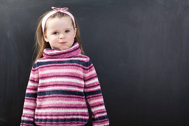 istock Cute girl in front of a chalkboard 174820807