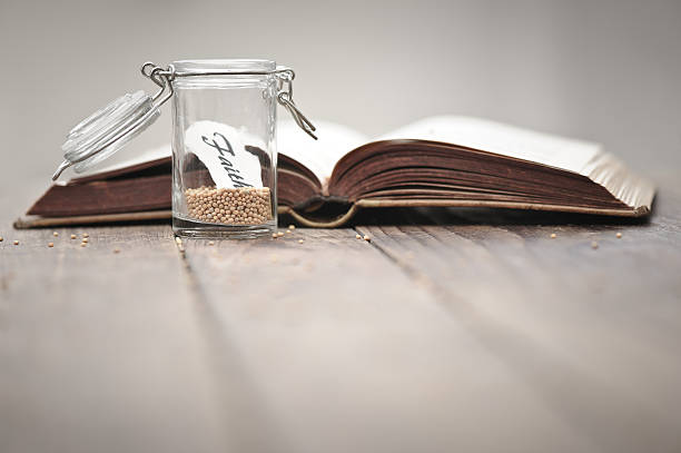 istock Mustard seeds in a jar and bible 174820971