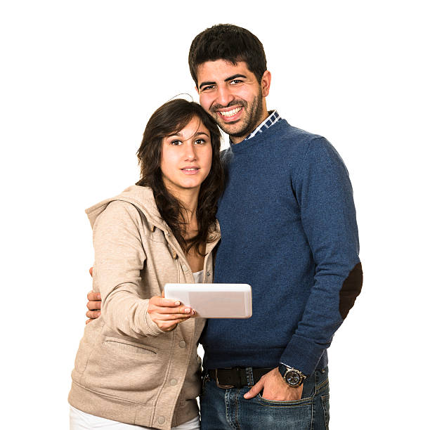 istock couple showing his tablet 174821295