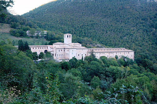 The old medieval monastery stands up in the apennines forest in Marche - Italy
