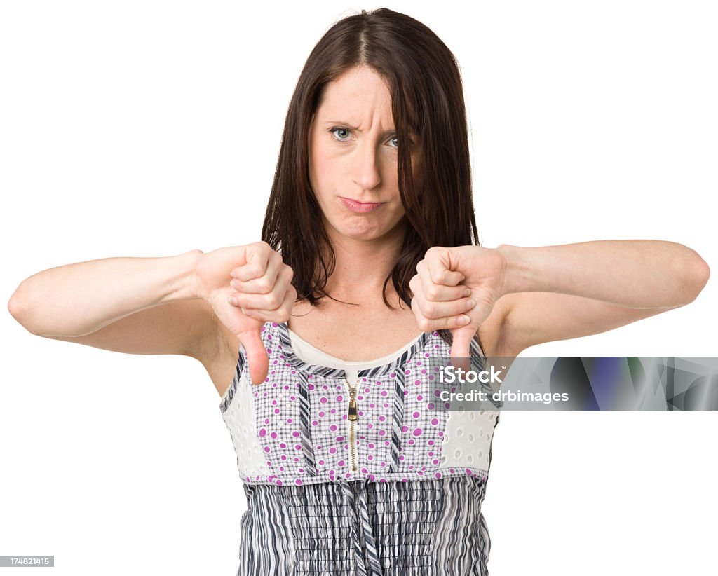 Устал молодая женщина дает большие пальцы вниз жеста - Стоковые фото 20-29 лет роялти-фри