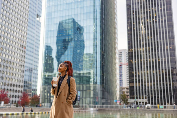 istock African Lady Walking Around The City While Holding Her Coffee 1748214574