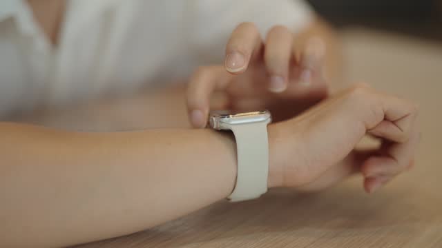 Close-up hand using a smart watch