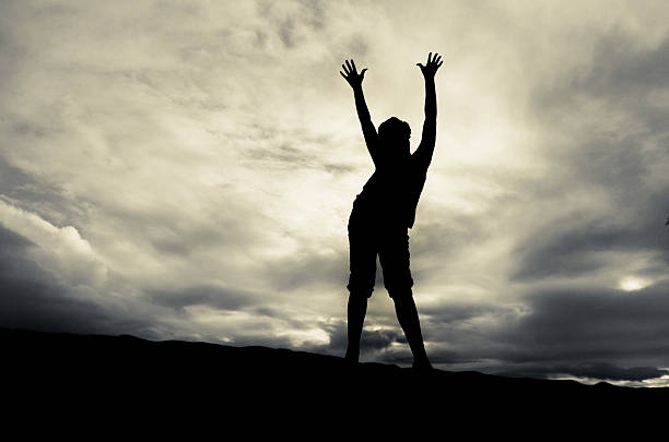 istock silhouetted person against dramatic sky 174821734