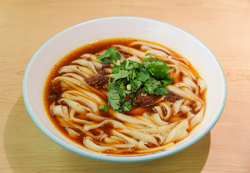 Knife-cut noodles, also known as knife-sliced noodles or knife-shaved noodles in English, are a type of noodle in Chinese cuisine often associated with Shanxi province. As the name implies, unlike pulled noodles, they are prepared by thinly cutting a block of dough directly into boiling water. The resulting noodles are ribbon-shaped, fairly thick, and chewy when cooked. Among the knife-cut noodle variations in Shanxi, the style from Datong became the most famous.