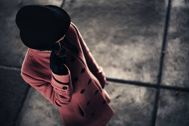 Woman in a Hat Mafia woman in a hat.bg - concrete floorlit with sunlightf2 macro lens femme fatale stock pictures, royalty-free photos & images