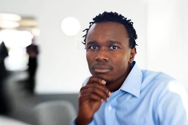 istock Thoughtful young African businessman looking at you 174822118