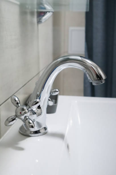 istock Chrome faucet in bathroom, close up. 1748221587