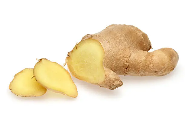 Whole and sliced ginger root in isolated white background