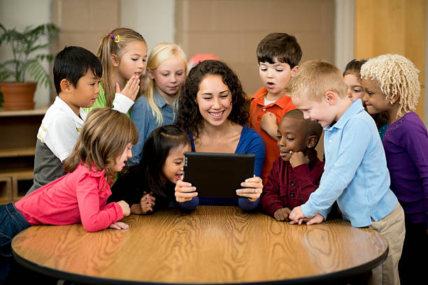 istock Teacher and Preschool students 174822434