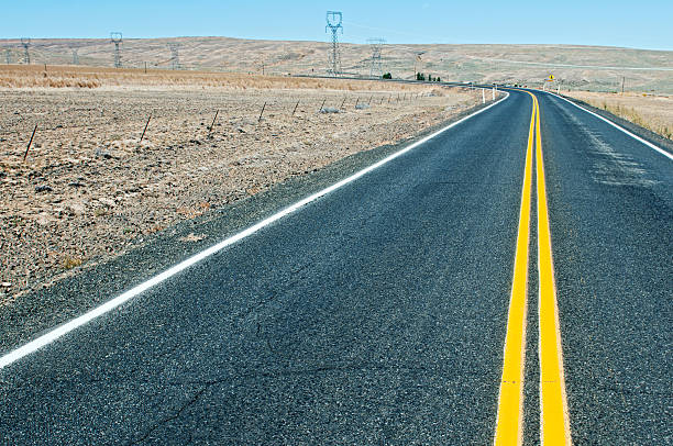 istock Rural road with newly painted yellow lines in Washington state 174822465