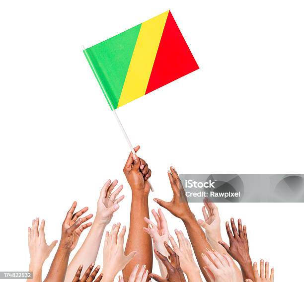 Congobrazzaville Bandera Foto de stock y más banco de imágenes de Agarrar - Agarrar, Alcanzar, Alzar la mano