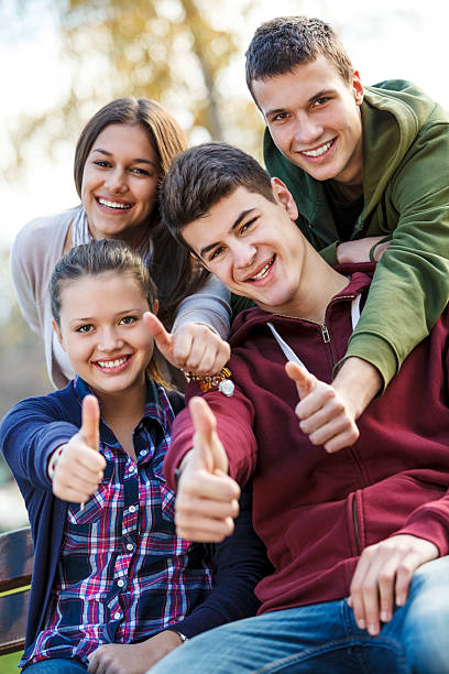 istock Group of a few students happy and giving a thumbs up 174822998