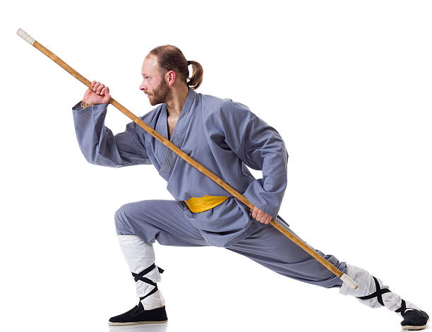 kung-fu luta posição com wushu cudgel isolado a branco - self defense wushu action aggression imagens e fotografias de stock