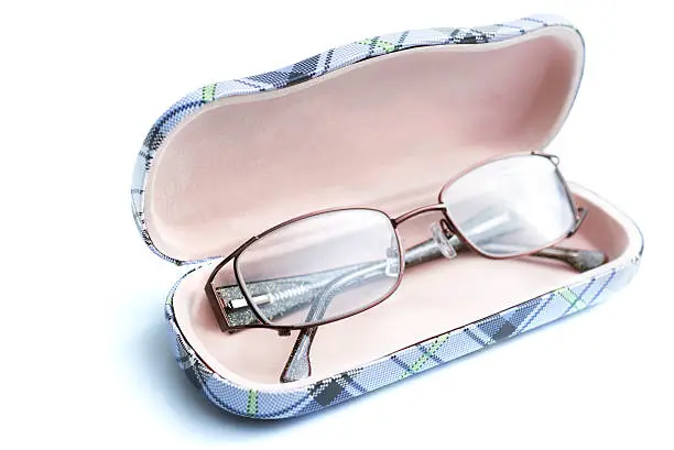 stylish reading glasses on casing. image on pure white.Related images: