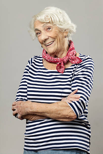 istock Beautiful senior woman smiling at camera 174823415