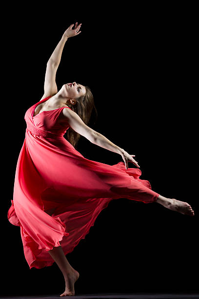 istock The Dancer with red dress on black 174823640