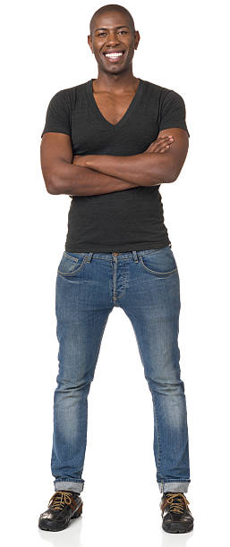 Happy Young Man Standing With Arms Crossed