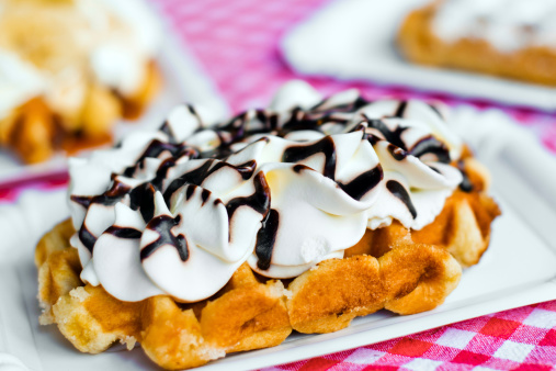 Belgian waffle with whipped cream and chocolate