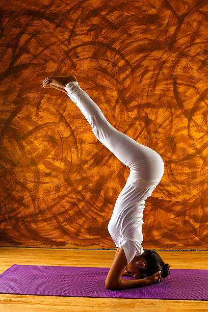 istock Young female yoga instructor doing asana 174824195