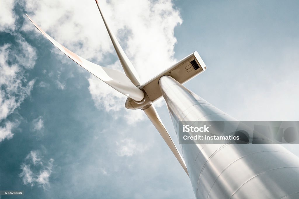 Wind turbine with blue gray sky Wind turbine in retro colors with added grain Pinwheel Toy Stock Photo