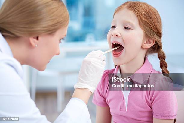 Doctor Examining Child Stock Photo - Download Image Now - 8-9 Years, Adult, Care