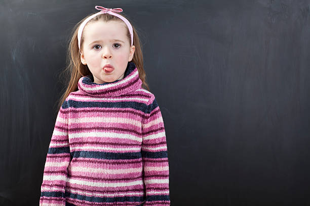 istock Cute girl in front of a chalkboard 174824778