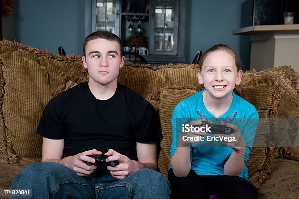 Young Children Playing Video Games On Television Stock Photo - Download Image Now - 12-13 Years, Activity, Blond Hair