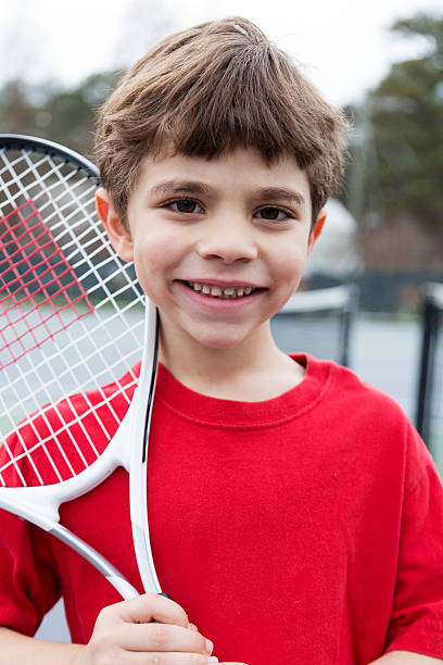 istock Little Boy and Tennis Racquet 174825049