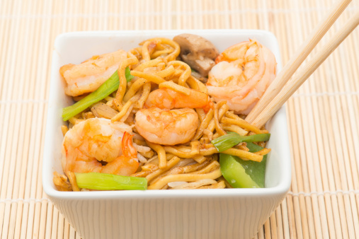 Chinese meal - Prawns with stir fried noodles - studio shot with a shallow depth of field