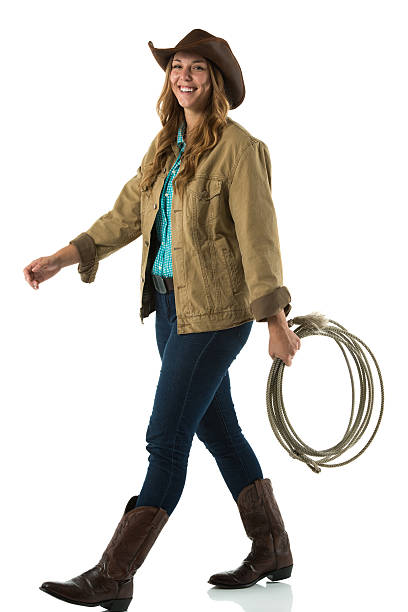 istock Cowgirl walking with lasso 174825513