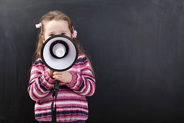 istock Cute girl in front of a chalkboard 174825657